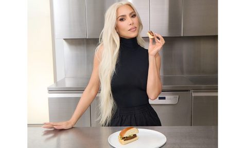 Kim Kardashian modeling with a Beyond Meat burger