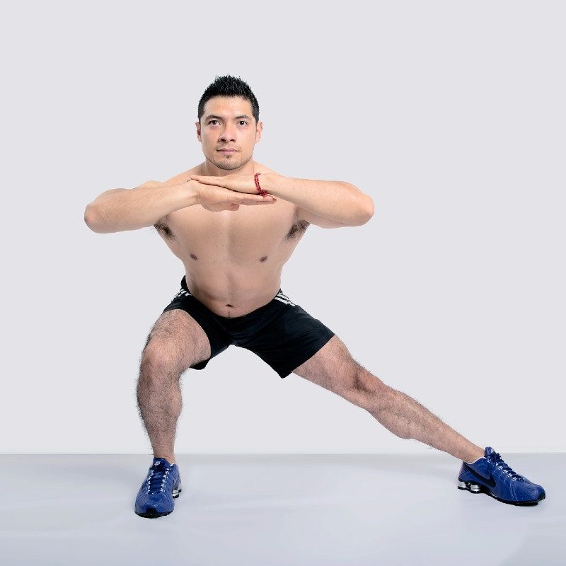 Man doing lateral lunge