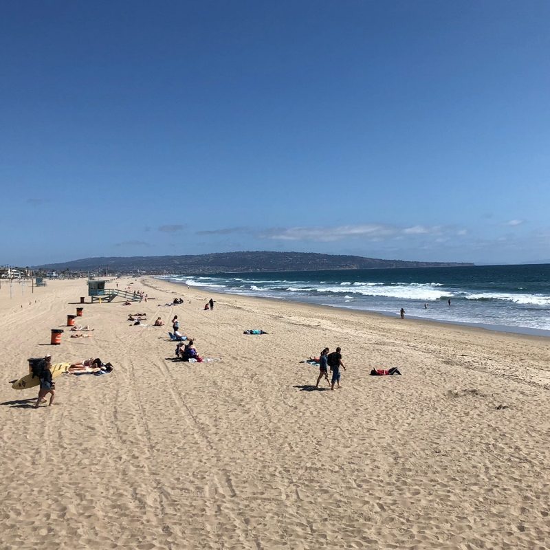 A view of the beach facing south toward the Palos Verdes Peninsula at Manhattan Beach, California
