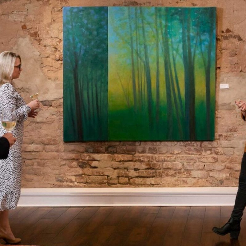A tour guide speaks about a painting at The Vendue hotel in Charleston, South Carolina.