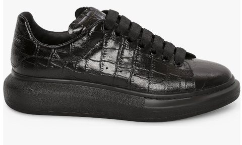 Black croc embossed oversize sneaker on a white background.