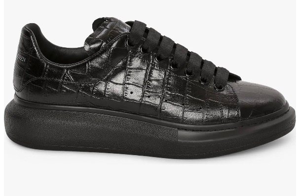 Black croc embossed oversize sneaker on a white background.