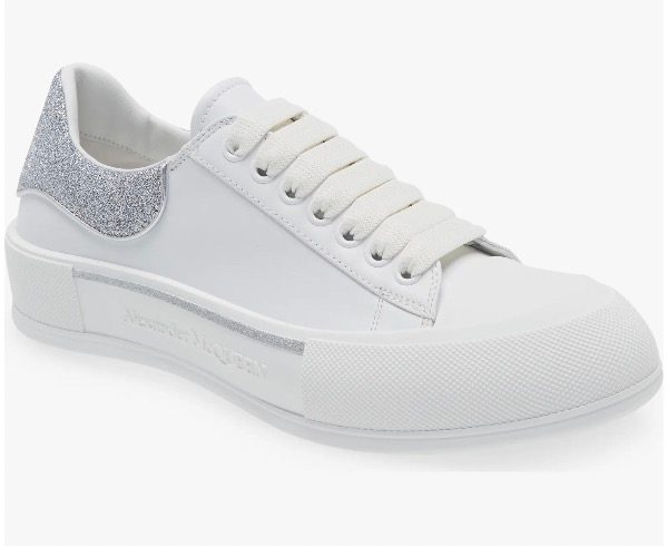 White sneaker with glitter trim on a white background.