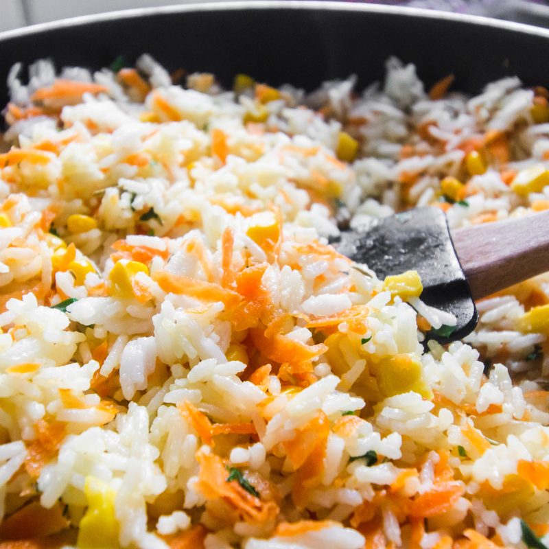 Frying rice in a skillet pan.