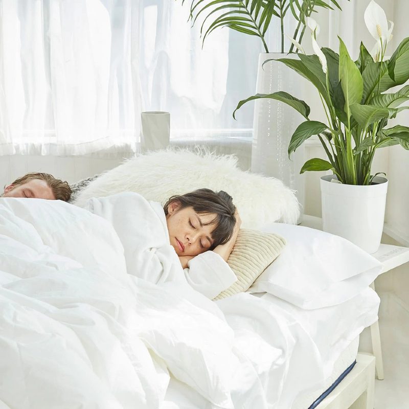 A couple sleep in the WinkBeds GravityLux mattress