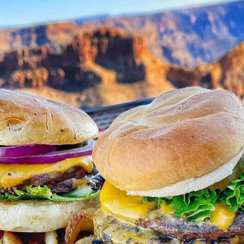 Two burgers with the Grand Canyon in the background