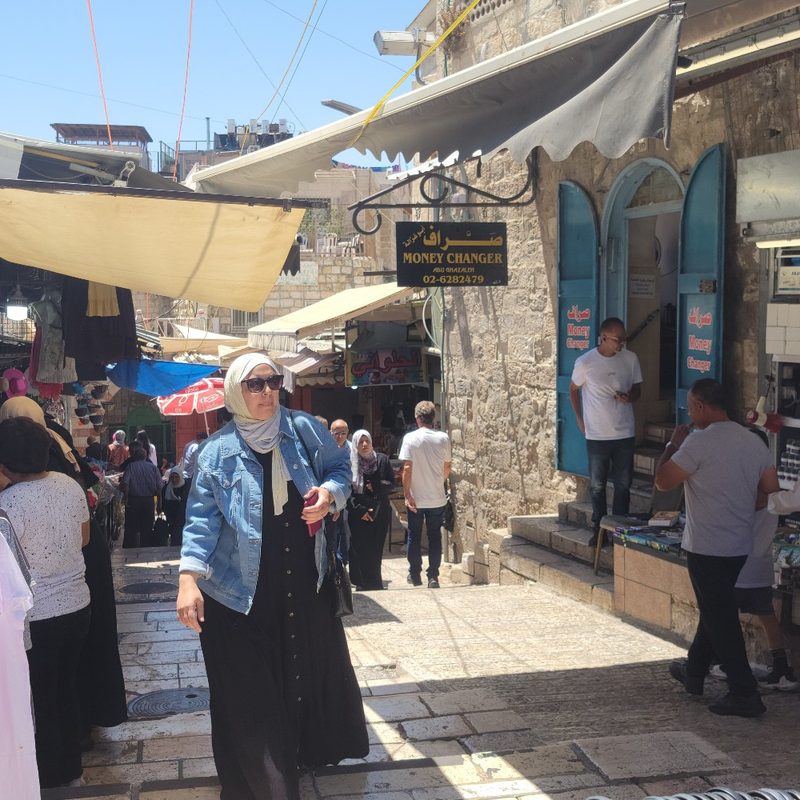 People walk through the streets of the Old City of Jerusalem.