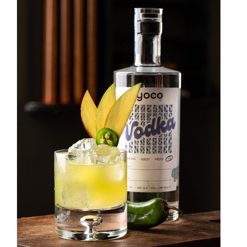 A YoCo Vodka bottle behind a Hot in Herre cocktail