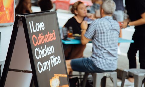 A sign at Mr. Loo's reading 'I Love Cultivated Chicken Curry Rice.'