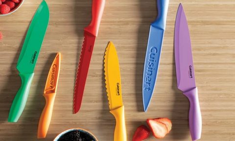 Cuisinart 12-piece multicolored knife set on cutting board with fruit