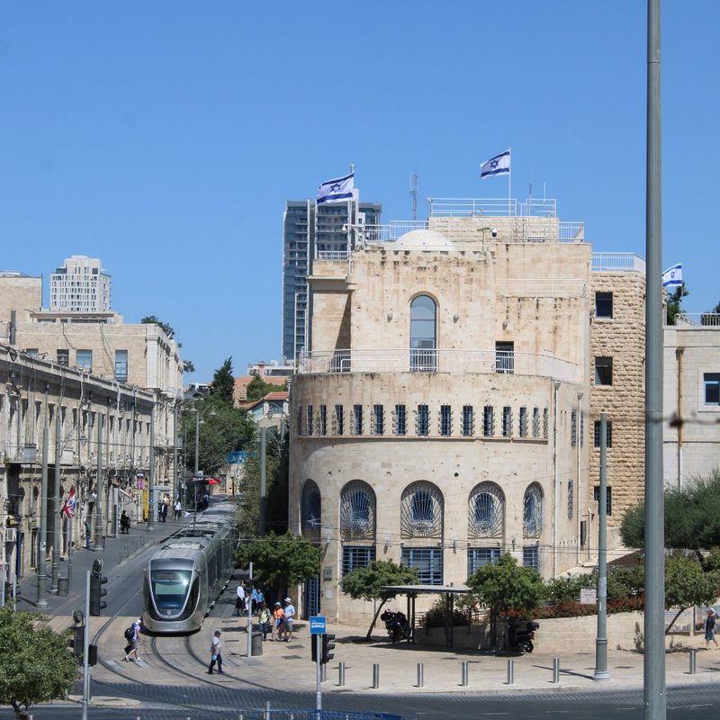 A light rail train operates near Jerusalem's Old City walls.