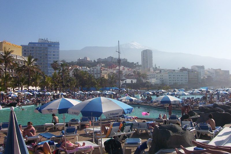 Puerto de la Cruz, Tenerife during winter, featuring background snowy mountains
