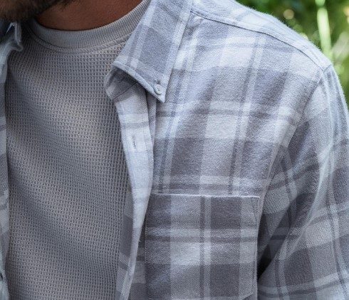 A plaid shirt over a T-shirt