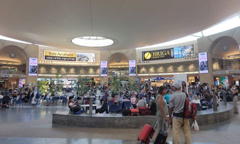 A couple navigate their way through David Ben Gurion Airport near Tel Aviv, Israel