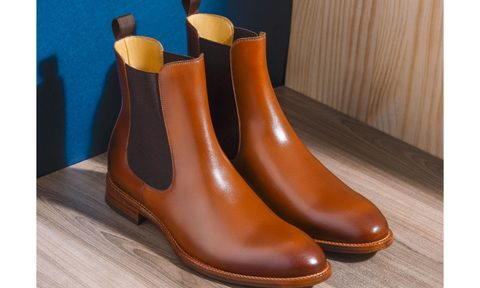 A pair of brown leather chelsea