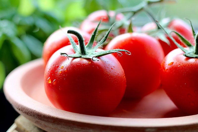 Fresh tomatoes on a plate.