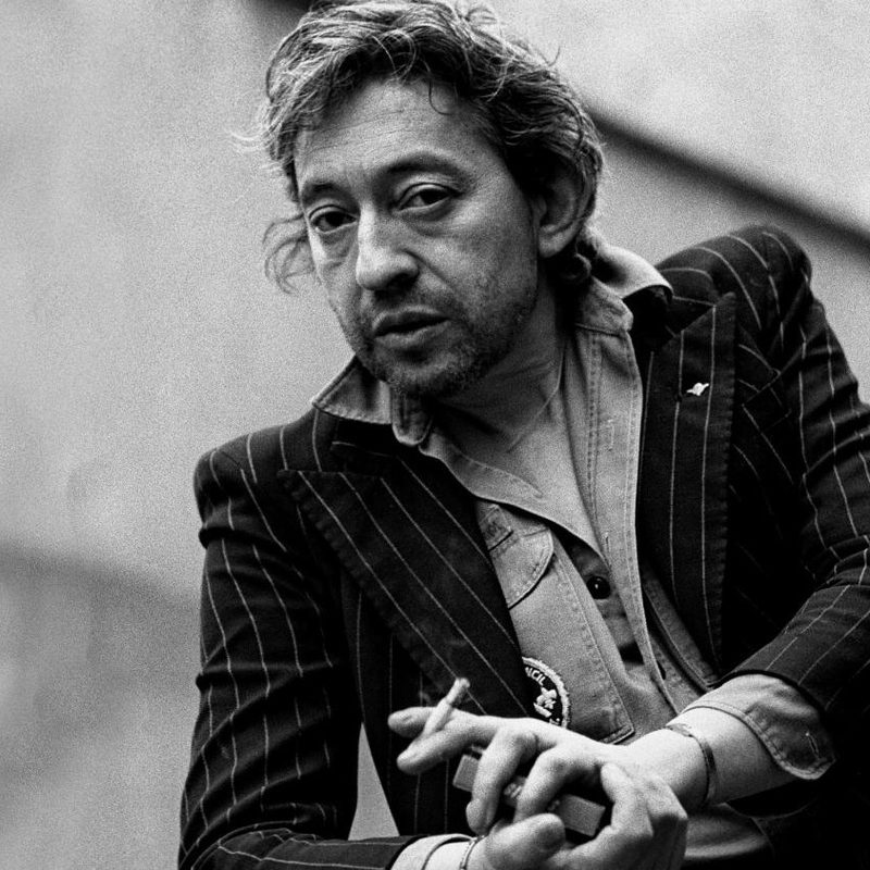 Serge Gainsbourg in a military shirt and suit jacket in Paris in 1980