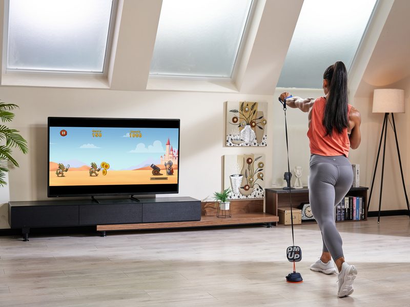 Unitree PUMP interactive fitness game on TV while working out.