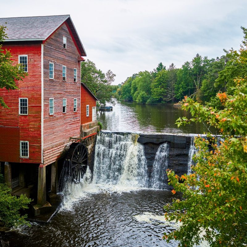 A red mill by the river in the Wisconsin Dells.
