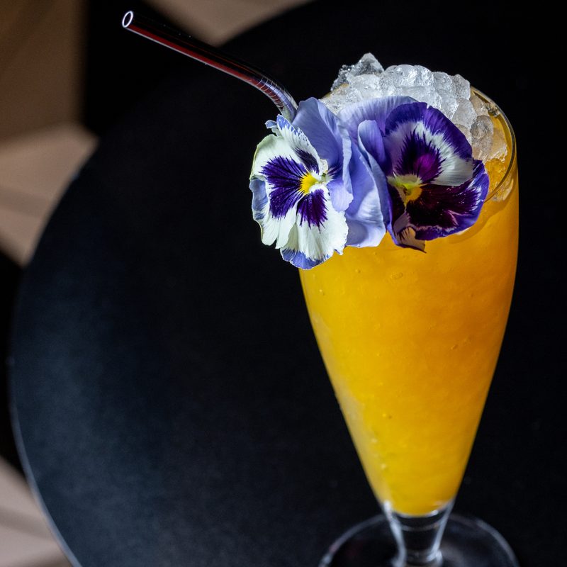 A Tiger's Jaw cocktail on a table.