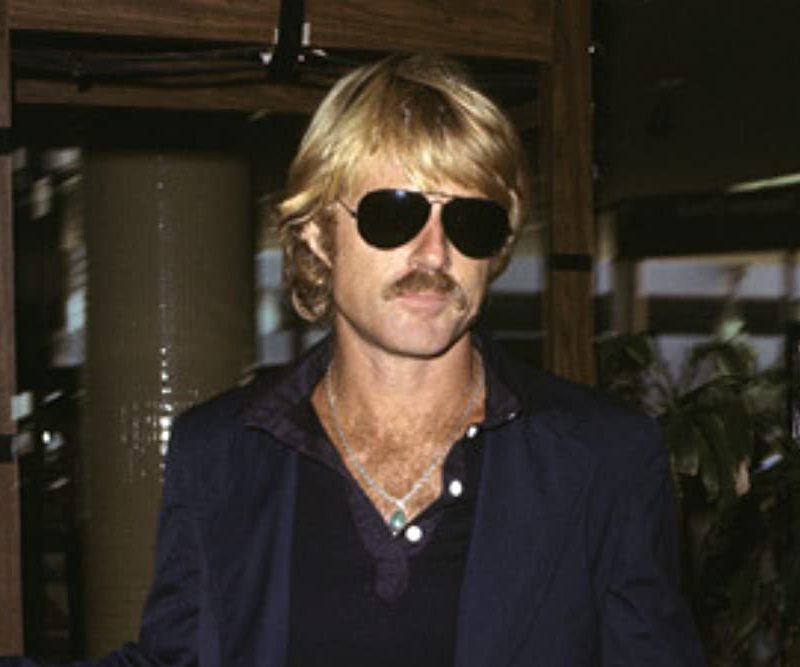 Robert Redford in aviator sunglasses.