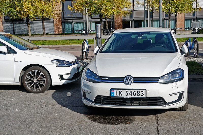 Two Volkswagen e-Golfs at a dedicated parking lot for EVs in Oslo, Norway.