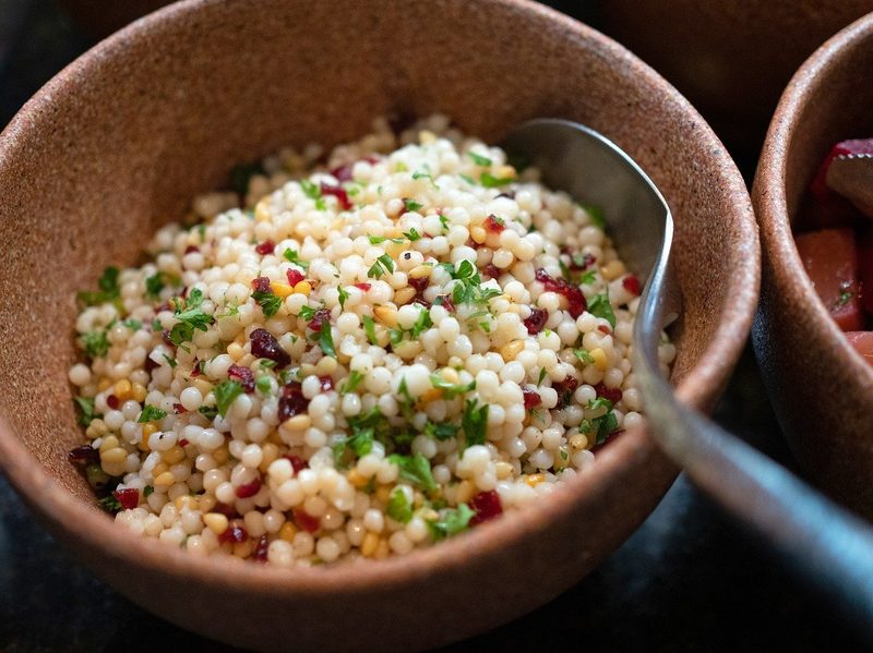 Couscous in a wooden bowl