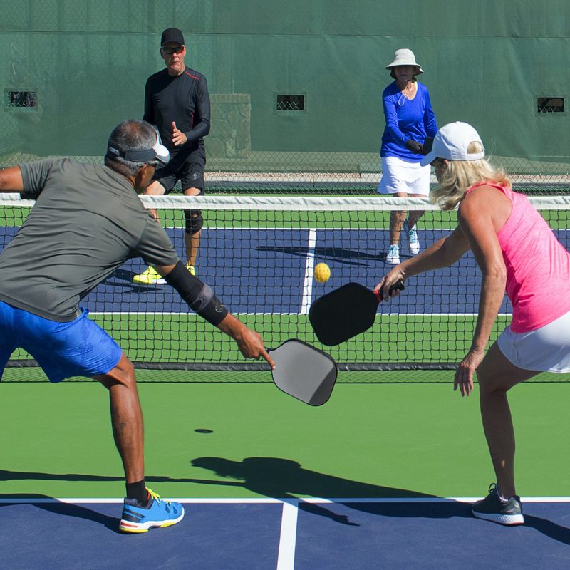 Group playing pickleball