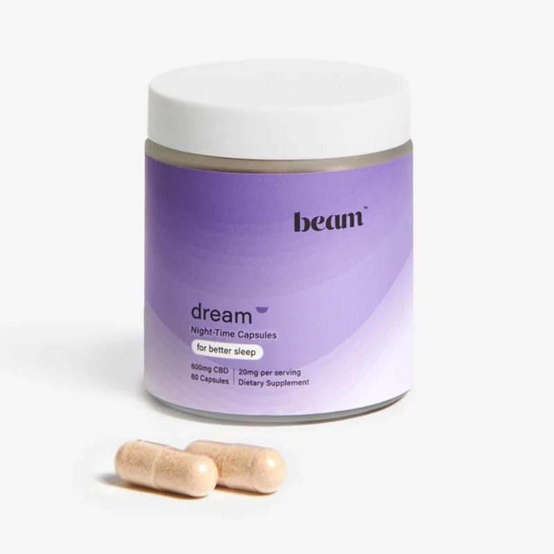A bottle of Beam Dream Capsules and a couple of capsules.
