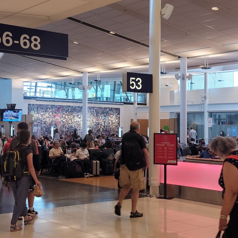 Travelers move through the terminal at Montr&eacute;al-Pierre Elliott Trudeau International Airport near Montr&eacute;al, Quebec, Canada.