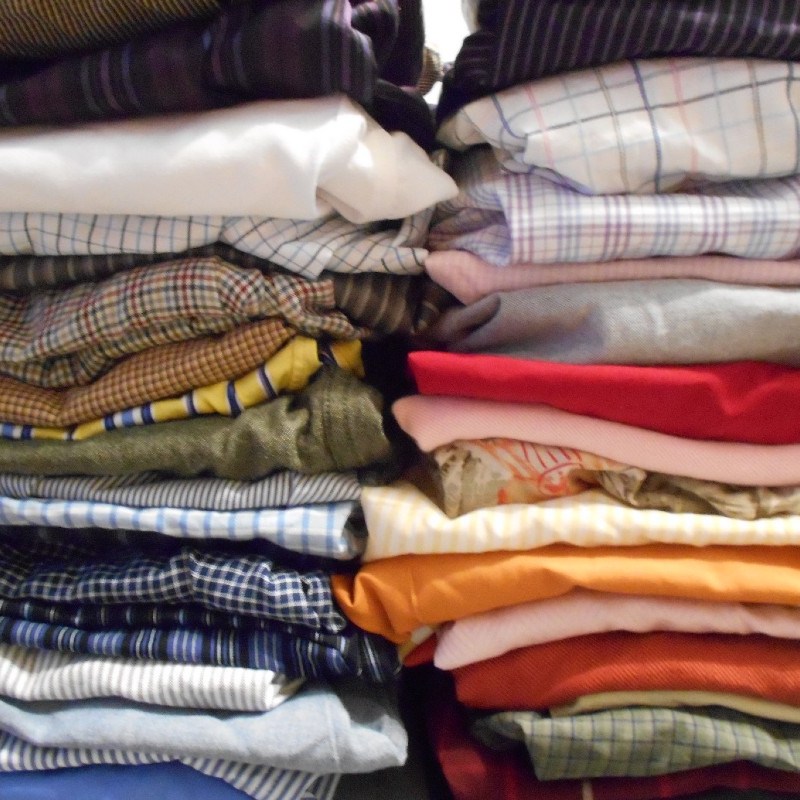 44 folded Goodwill shirts.
