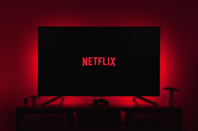 Netflix logo on tv with red back lighting
