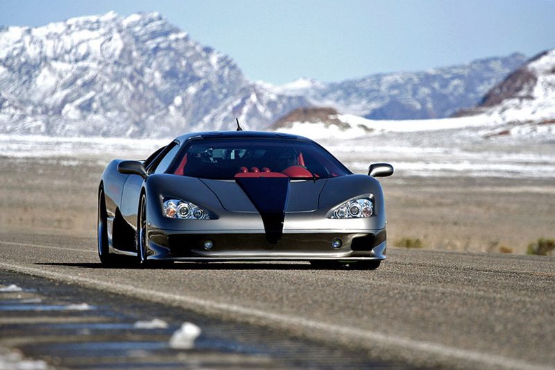 SSC Ultimate Aero TT on a race track with snow-covered mountains in the back.