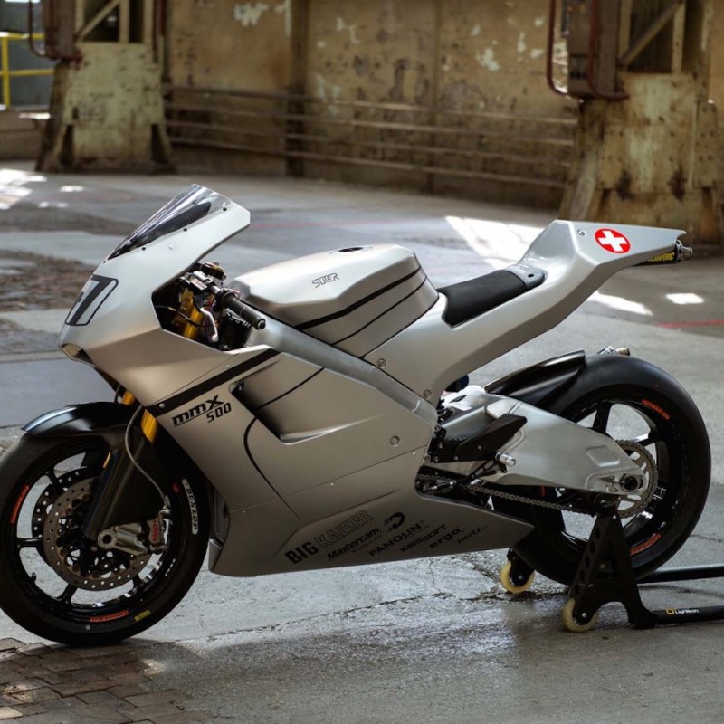 Suter Racing MMX 500 parked in a building on wet concrete.