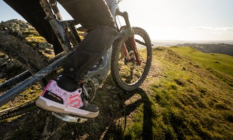 Riding a mountain bike in the Five Ten Freerider Pro BCA shoes.