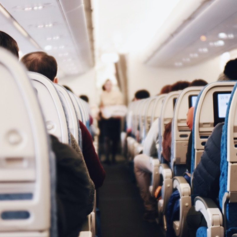 People seated on a full flight