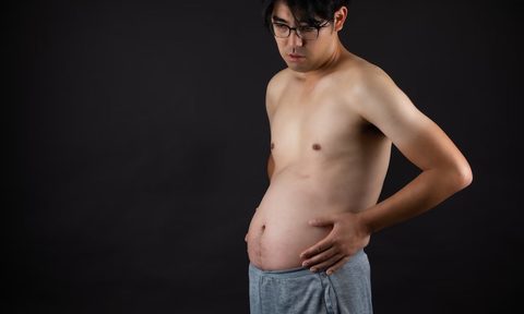 Man with bloated tummy.