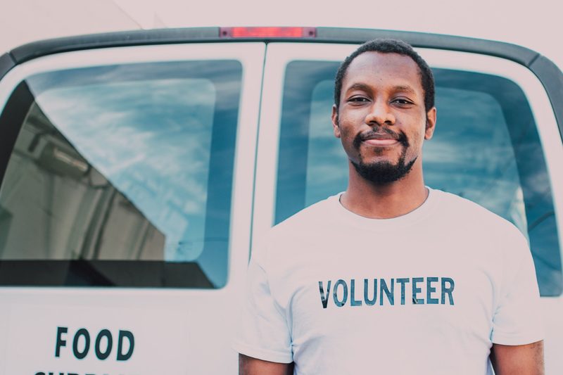 Man wearing a volunteer t-shirt