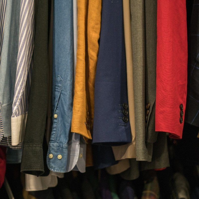 Men's shirts hanging in a closet