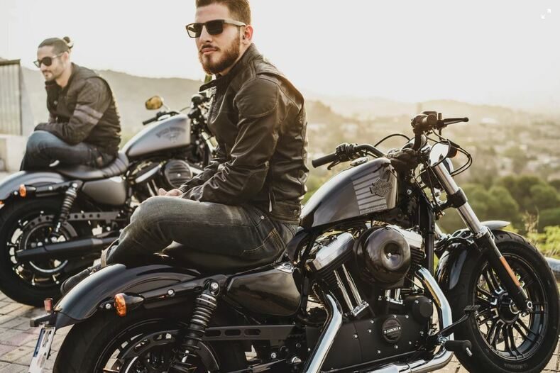 Guy in leathers on a motorcycle