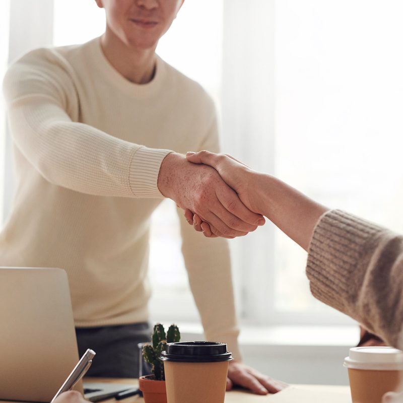 People shaking hands at a job interview