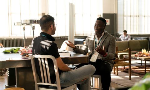 how to negotiate a 4 day work week two men meeting in office