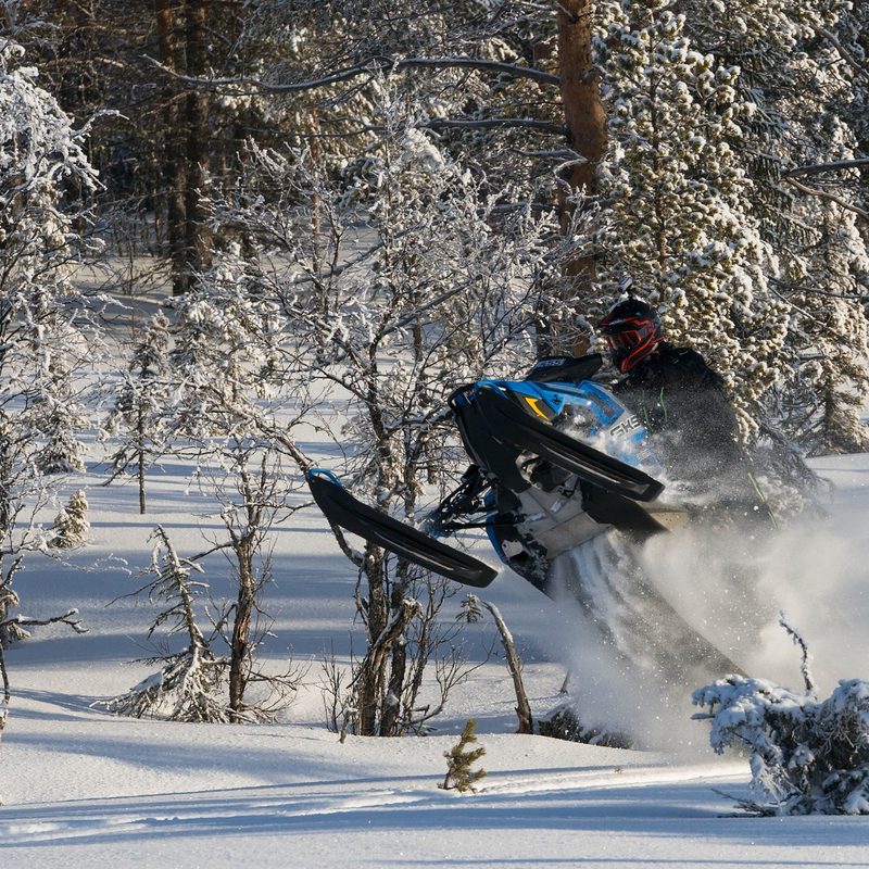 Riding a snowmobile off road in northern Wisconsin.