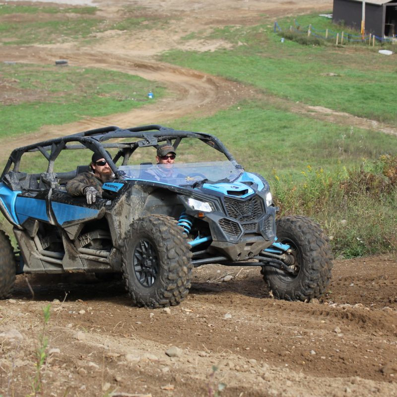 Climbing a hill off road in a Can Am Maverick side by side.