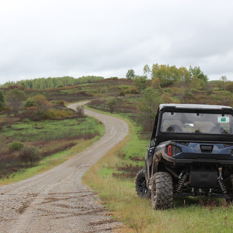 off-road vehicle near a dirt road