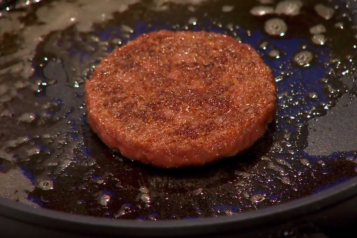 First cultured hamburger being fried in 2013.