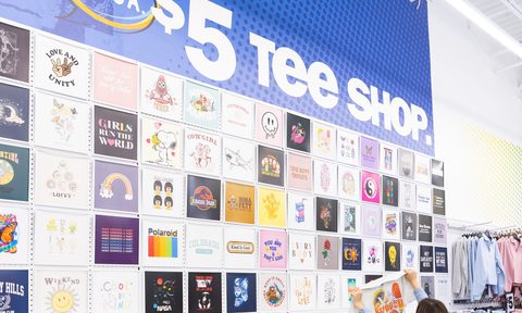Five Below graphic tee selection wall in store.