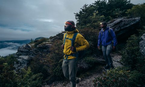 Two men walk a trail using the BioLite HeadLamp 425.