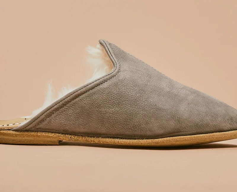 A gray shearling mule slipper