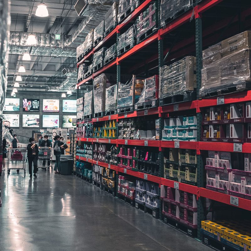 Costco aisle full of shoppers.
